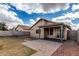 Spacious backyard featuring a covered patio, ideal for enjoying the outdoors at 1100 E Vernoa St, San Tan Valley, AZ 85140