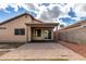 Exterior view of the back of the home, showcasing a covered patio and well-kept yard at 1100 E Vernoa St, San Tan Valley, AZ 85140