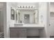 Bright bathroom features a modern sink, gray vanity, and well-lit mirror at 1100 E Vernoa St, San Tan Valley, AZ 85140