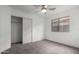 A bedroom featuring a closet and carpeted floors at 1100 E Vernoa St, San Tan Valley, AZ 85140