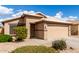 This cute single-story home showcases a two-car garage, low maintenance desert landscaping, and a beautiful tile roof at 1100 E Vernoa St, San Tan Valley, AZ 85140