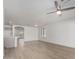 Bright living room with new ceiling fan, wood floors, and fresh white walls at 1100 E Vernoa St, San Tan Valley, AZ 85140