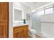 Modern bathroom with white vanity, glass shower, and wood-look accents at 11686 N Spotted Horse Way, Fountain Hills, AZ 85268