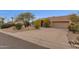 Charming home featuring a two car garage and a circular driveway with xeriscaping at 11686 N Spotted Horse Way, Fountain Hills, AZ 85268