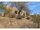 Exterior view of stucco house with desert landscaping and gravel in the yard at 11686 N Spotted Horse Way, Fountain Hills, AZ 85268