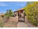 Charming home featuring a gated front yard and covered porch with desert landscaping at 11686 N Spotted Horse Way, Fountain Hills, AZ 85268