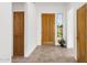 Hallway with ceramic tile floors and wooden doors, plus a stained glass desert mural at 11686 N Spotted Horse Way, Fountain Hills, AZ 85268