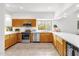 Kitchen with stainless steel appliances, light wood cabinets, and light countertops at 11686 N Spotted Horse Way, Fountain Hills, AZ 85268