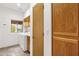 Practical laundry room featuring a window, washer, dryer, storage cabinets, and tiled floor at 11686 N Spotted Horse Way, Fountain Hills, AZ 85268