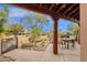 Charming covered patio with wooden columns and seating area, perfect for outdoor entertaining at 11686 N Spotted Horse Way, Fountain Hills, AZ 85268