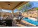 Inviting outdoor patio area with a luxurious pool, spa, and comfortable seating at 12320 W Lone Tree Trl, Peoria, AZ 85383