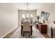 Elegant dining room with stylish chandelier and modern decor at 12320 W Lone Tree Trl, Peoria, AZ 85383