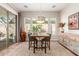 Bright dining area with a view of the pool, modern decor and plenty of light at 12320 W Lone Tree Trl, Peoria, AZ 85383