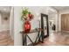 Stylish entryway featuring a decorative table with flowers and a large mirror at 12320 W Lone Tree Trl, Peoria, AZ 85383