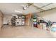 Spacious garage with ample storage cabinets and organized shelving at 12320 W Lone Tree Trl, Peoria, AZ 85383