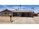 Charming single-story home featuring a covered carport, low maintenance landscaping, and neutral exterior paint at 12402 N 36Th Dr, Phoenix, AZ 85029