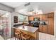 Efficient kitchen featuring bar stool seating, ample counter space, and modern appliances at 12402 N 36Th Dr, Phoenix, AZ 85029