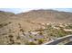 Aerial view of community parking area at mountain base, featuring surrounding desert vegetation at 1356 E Desert Flower Ln, Phoenix, AZ 85048