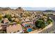 Scenic aerial view of a community with beautiful desert landscaping and private pools with mountain views at 1356 E Desert Flower Ln, Phoenix, AZ 85048