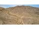 High angle aerial view of mountain with arid desert vegetation featuring cell and radio towers at 1356 E Desert Flower Ln, Phoenix, AZ 85048