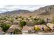 An aerial view of a Primary planned community with many amenities and nearby mountain views at 1356 E Desert Flower Ln, Phoenix, AZ 85048