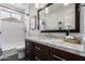 Bright bathroom featuring a tub, shower, and stylish white tile at 1356 E Desert Flower Ln, Phoenix, AZ 85048