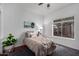 Comfortable bedroom featuring natural light, carpet, and a ceiling fan at 1356 E Desert Flower Ln, Phoenix, AZ 85048