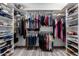 Organized walk-in closet featuring ample storage and shelving at 1356 E Desert Flower Ln, Phoenix, AZ 85048