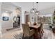 Dining room filled with natural light and stylish light fixtures at 1356 E Desert Flower Ln, Phoenix, AZ 85048