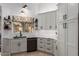 Bright kitchen featuring sleek cabinets, modern appliances, and a window overlooking the backyard at 1356 E Desert Flower Ln, Phoenix, AZ 85048