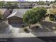 Aerial view of single-story home featuring mature landscaping and large driveway at 1391 E 12Th St, Casa Grande, AZ 85122