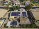 Aerial view of a home featuring solar panels, a covered patio, shed, and a gazebo in a walled backyard at 1391 E 12Th St, Casa Grande, AZ 85122