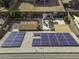 Close aerial view of rooftop solar panels on a tile roof, overlooking a backyard gazebo and shed at 1391 E 12Th St, Casa Grande, AZ 85122