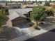 Aerial view of a single-story home featuring a two-car garage and mature landscaping at 1391 E 12Th St, Casa Grande, AZ 85122