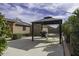 View of the backyard featuring a gazebo, barbeque, and outdoor storage shed at 1391 E 12Th St, Casa Grande, AZ 85122