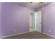 Bedroom showcasing neutral carpet and pale purple paint at 1391 E 12Th St, Casa Grande, AZ 85122