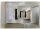 Bright entryway featuring neutral tile flooring and a view into the living area at 1391 E 12Th St, Casa Grande, AZ 85122