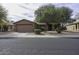 Charming single-story home with a well-maintained front yard and mature shade trees at 1391 E 12Th St, Casa Grande, AZ 85122