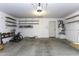 Spacious garage with overhead lighting, built-in shelving, and a door, providing ample storage at 1391 E 12Th St, Casa Grande, AZ 85122