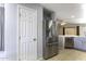 Kitchen with stainless steel refrigerator and view of breakfast nook at 1391 E 12Th St, Casa Grande, AZ 85122