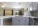 Kitchen with stainless steel dishwasher and view of the backyard at 1391 E 12Th St, Casa Grande, AZ 85122