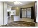 Open living area featuring hard surface flooring, neutral walls, and views into the kitchen at 1391 E 12Th St, Casa Grande, AZ 85122