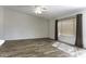 Bright living area with neutral walls, wood flooring, and a ceiling fan at 1391 E 12Th St, Casa Grande, AZ 85122