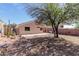 Lush backyard with a covered patio, providing ample space for outdoor enjoyment and dining at 1422 S 231St Ln, Buckeye, AZ 85326