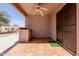 Covered patio features tile flooring and ceiling fan, offering a comfortable outdoor living space at 1422 S 231St Ln, Buckeye, AZ 85326