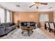 Inviting living room with plush gray sofas, stylish decor, and a cozy area rug, perfect for relaxing and entertaining at 1422 S 231St Ln, Buckeye, AZ 85326