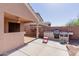 Stylish outdoor kitchen with built-in grill and countertop, perfect for alfresco cooking and entertaining at 1422 S 231St Ln, Buckeye, AZ 85326