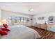 Bright bedroom boasts a bay window with shutters and hardwood floors, creating a cozy and inviting atmosphere at 14710 W Yosemite Dr, Sun City West, AZ 85375