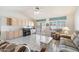 Bright living room with a ceiling fan, tile floors, and a comfortable seating area at 14710 W Yosemite Dr, Sun City West, AZ 85375