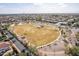 Expansive aerial view of a park with lush greenery and a covered gazebo surrounded by single Gathering homes at 1473 E Mead Dr, Chandler, AZ 85249